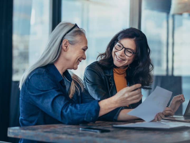 Two women reviewing a document