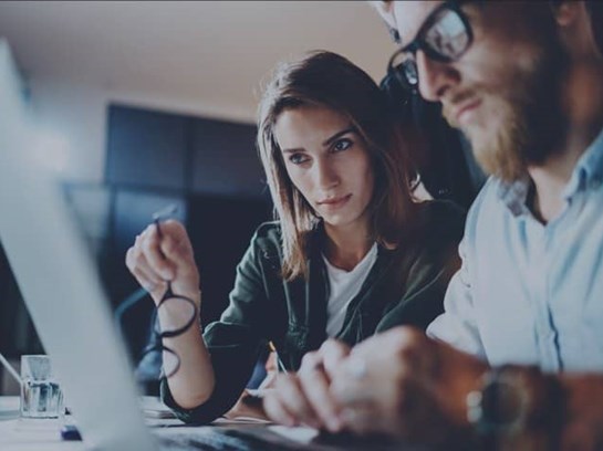 Woman And Man Working Laptop